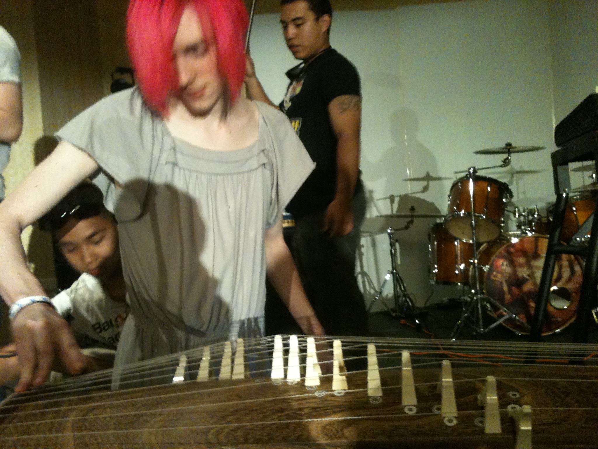 Robbi playing koto during soundcheck while Mike and Suan get ready to film the performance. Photo by Amanda Manzanares